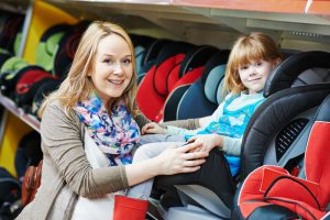 Mother and child choosing convertible car seat